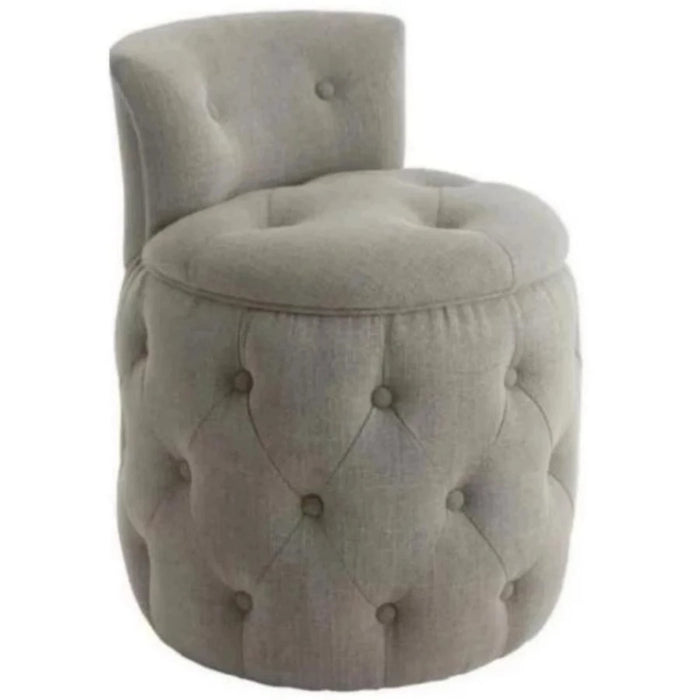 A deep button foot stool in grey fabric